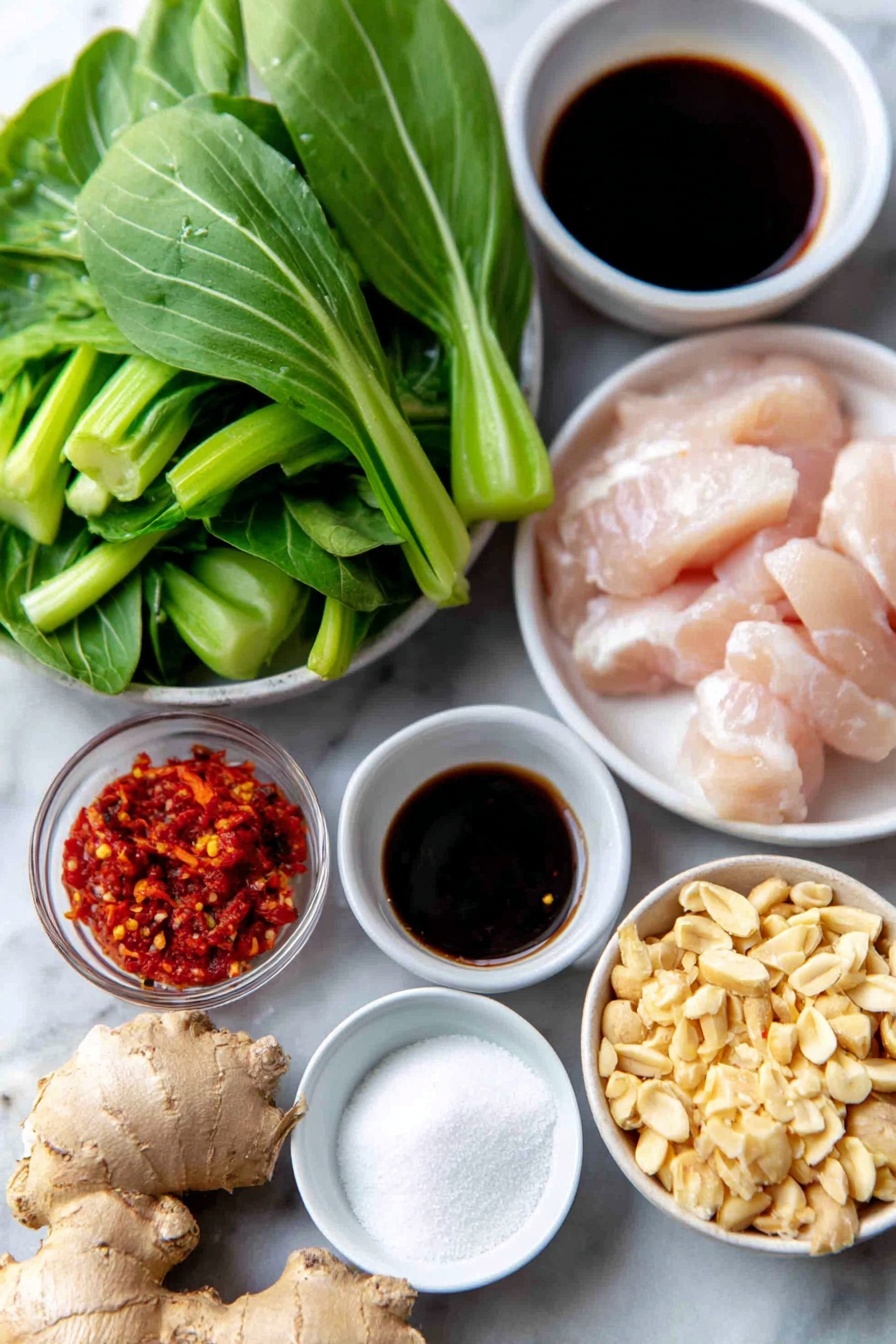 Flat lay of a small white ceramic bowl of minced fresh ginger, a small white ceramic bowl of reduced sodium soy sauce, a small white ceramic bowl of rice vinegar, a small white ceramic bowl of minced garlic cloves, a small white ceramic bowl of granulated sugar, a small white ceramic bowl of toasted sesame oil, a small white ceramic bowl of cornstarch, a small white ceramic bowl of red chili paste, thin sliced raw boneless chicken breast cutlets arranged neatly, a small mound of vegetable oil in a small white ceramic bowl, a medium red onion cut into half-inch chunks arranged in a neat pile, fresh baby bok choy roughly chopped with visible green leaves and white stalks, a small white ceramic bowl of dry-roasted peanuts, fresh torn Thai basil leaves scattered carefully, all ingredients placed on a clean white marble surface, soft natural light, photo taken with an iPhone, professional food photography style, fresh ingredients, white ceramic bowls, no bottles, no duplicates, no utensils, no packaging --ar 2:3 --v 7 --p m7354615311229779997