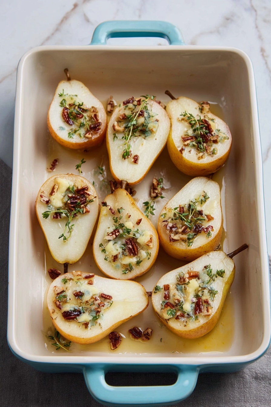 The image shows a rectangular white ceramic baking dish with light blue handles, placed on a white marbled surface. Inside the dish, there are eight halved pears arranged in two rows, with the cut sides facing up. Each pear half is topped with a small pool of melted creamy butter, sprinkled with small chunks of pecans and fresh green herbs, likely thyme. The pears have a golden-yellow skin with some light brown marks, and the juicy white flesh looks soft and cooked. A few spots of caramelized syrup are visible in the dish, creating a glossy effect around the pear halves. Photo taken with an iphone --ar 2:3 --v 7