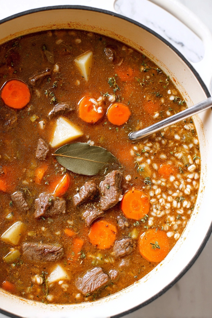 The image shows a close-up of a white pot filled with a stew that has multiple layers and ingredients. There is an orange-brown broth that looks thick and rich. Inside the broth, there are chunked orange carrots, light yellow potato pieces, and small bits of brown beef scattered throughout. A dark green bay leaf floats on the surface near the center right. Some finely chopped herbs and seasonings are visible in the broth, adding texture and seasoning specks. The pot sits on a white marbled surface, and part of a metal ladle is submerged on the right side. The edges of the pot show a worn brown stain from cooking. The photo taken with an iphone --ar 2:3 --v 7