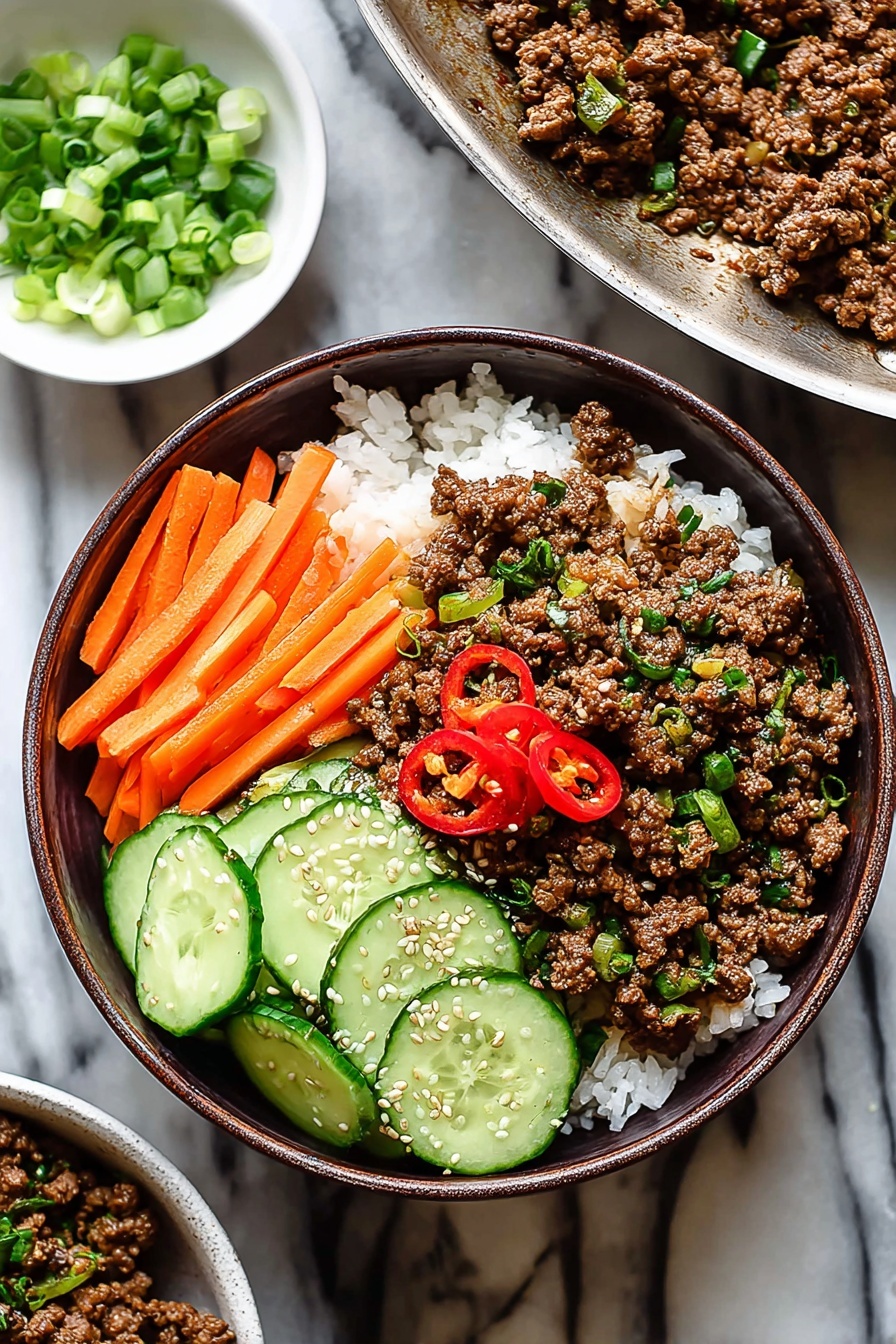 A white plate holds two layers: the bottom layer is white rice with a slightly shiny and soft texture, and the top layer is cooked ground meat mixed with small pieces of green onions, adding splashes of green color on top of the brown meat. The rice is spread evenly on the plate, while the meat sits mainly in the center, piled slightly higher. The background shows a white marbled texture surface, with a small white bowl of sesame seeds and a glass jar with a dark liquid, both out of focus behind the plate. A fork and knife rest on a folded beige cloth beside the plate. Photo taken with an iphone --ar 2:3 --v 7