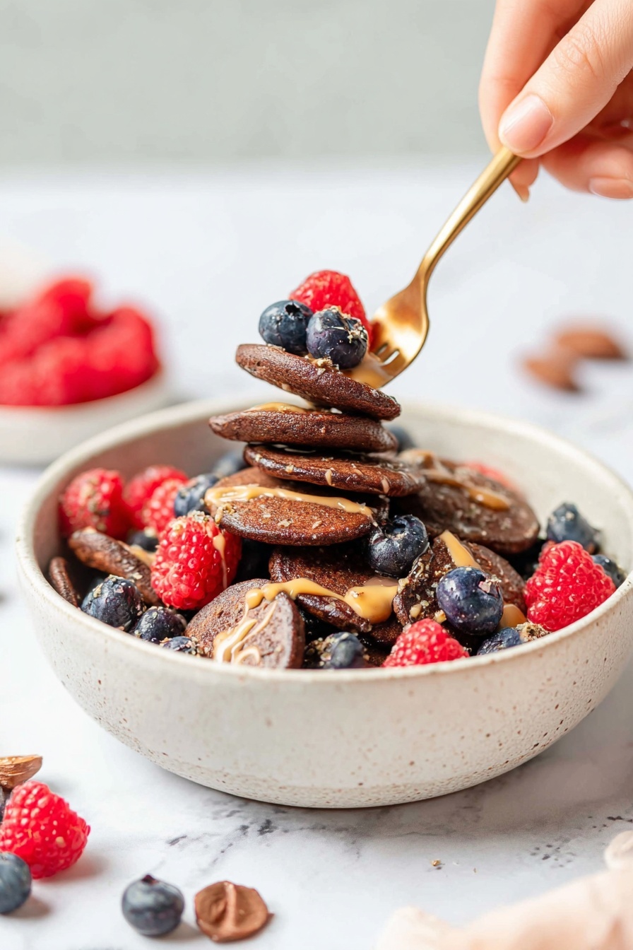 The image shows a top view inside a clear blender jar placed on a white marbled surface. Inside, there are six visible layers and ingredients: on the left, light brown rolled oats, next to it a light tan peeled banana, patches of white powder scattered across the top, several dark brown spots of cocoa powder spread unevenly across the ingredients, and a dark liquid layer beneath clinging slightly to the sides, with the blender's sharp silver blades in the center. photo taken with an iphone --ar 2:3 --v 7